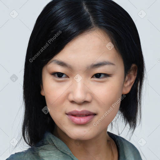 Joyful asian young-adult female with medium  black hair and brown eyes