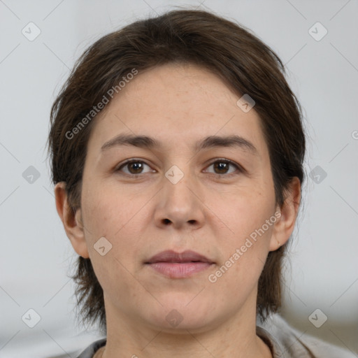 Joyful white adult female with medium  brown hair and brown eyes