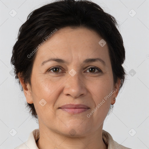 Joyful white adult female with short  brown hair and brown eyes