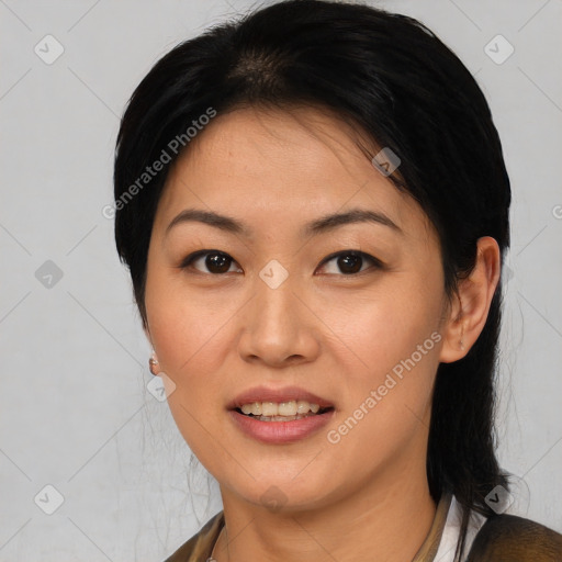 Joyful asian young-adult female with medium  black hair and brown eyes