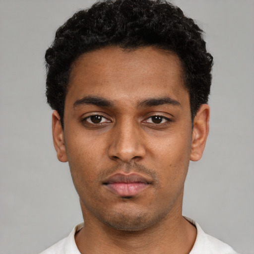 Neutral black young-adult male with short  black hair and brown eyes