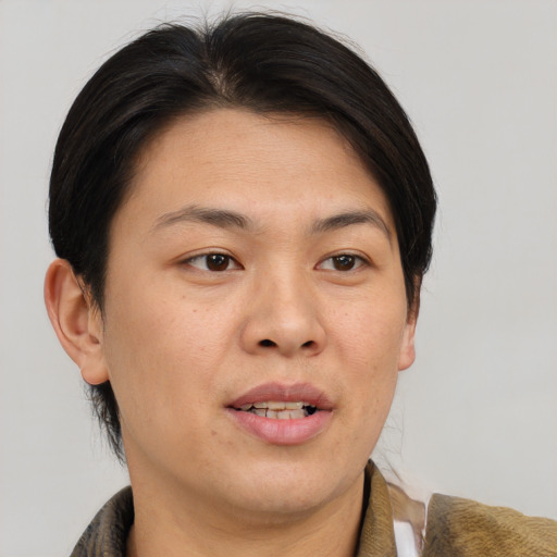 Joyful white adult female with short  brown hair and brown eyes