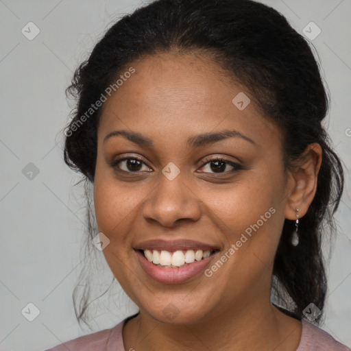 Joyful black young-adult female with medium  brown hair and brown eyes