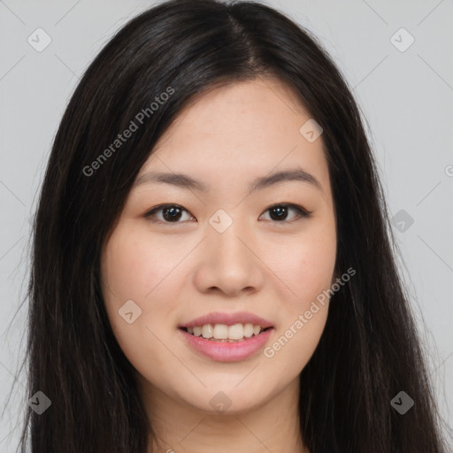 Joyful asian young-adult female with long  brown hair and brown eyes