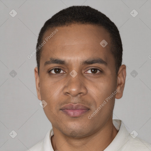Joyful black young-adult male with short  brown hair and brown eyes