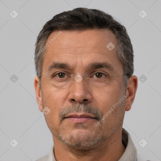 Neutral white middle-aged male with short  brown hair and brown eyes