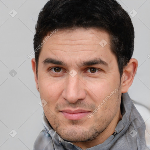 Joyful white adult male with short  brown hair and brown eyes