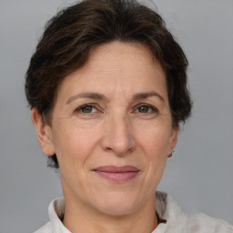 Joyful white adult female with short  brown hair and brown eyes