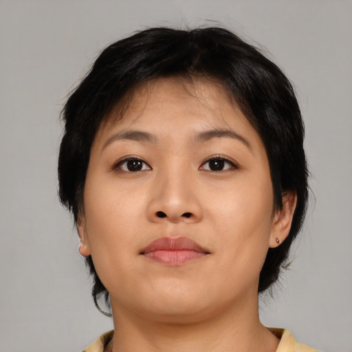 Neutral asian young-adult female with medium  brown hair and brown eyes