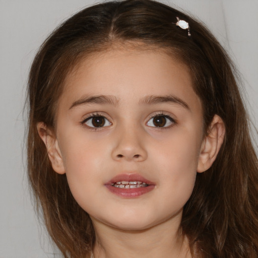 Joyful white child female with medium  brown hair and brown eyes