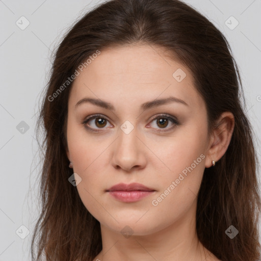 Neutral white young-adult female with long  brown hair and brown eyes