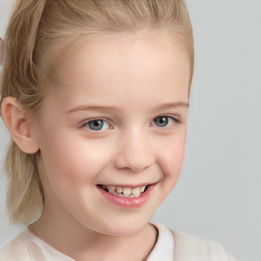 Joyful white child female with short  blond hair and blue eyes