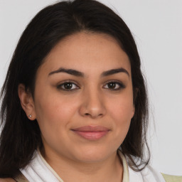 Joyful latino young-adult female with medium  brown hair and brown eyes