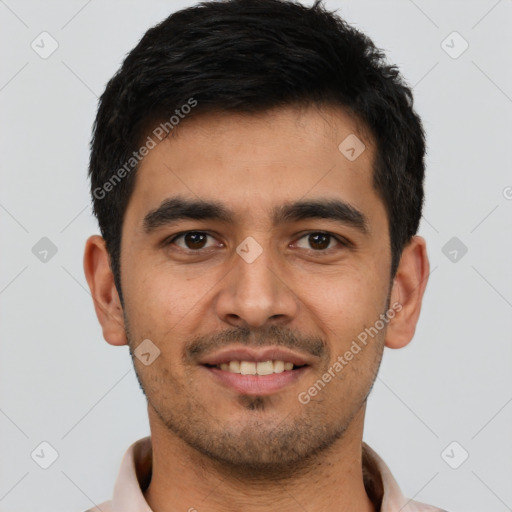 Joyful latino young-adult male with short  black hair and brown eyes