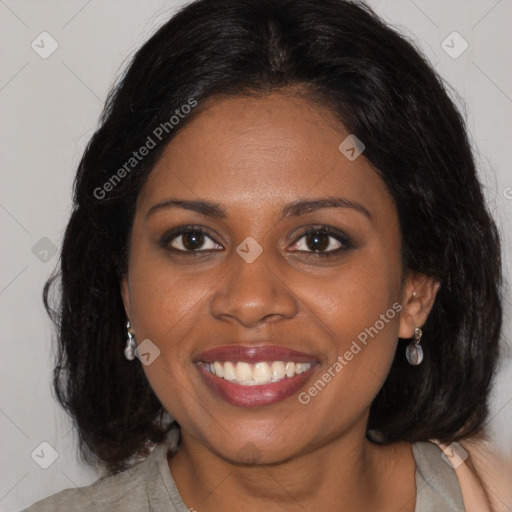 Joyful black young-adult female with medium  brown hair and brown eyes