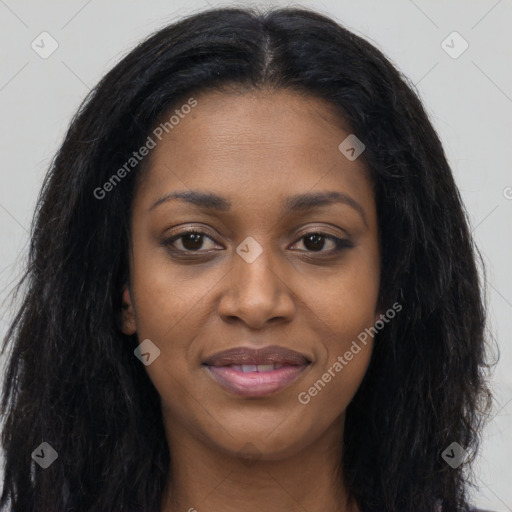Joyful black young-adult female with long  black hair and brown eyes
