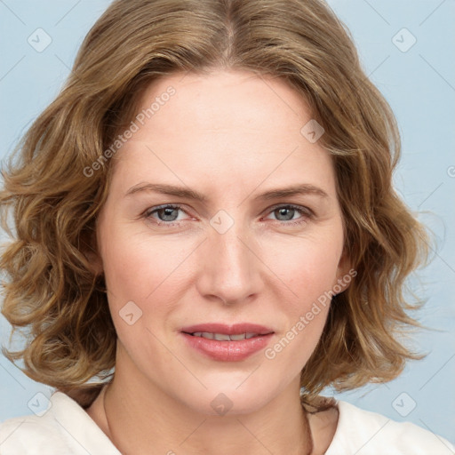 Joyful white young-adult female with medium  brown hair and blue eyes