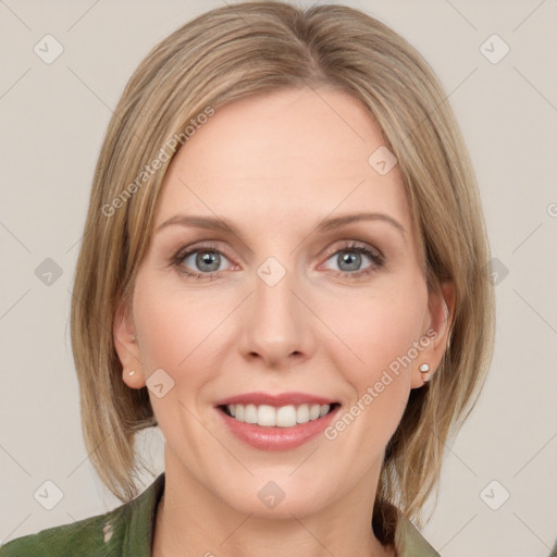 Joyful white young-adult female with medium  brown hair and blue eyes