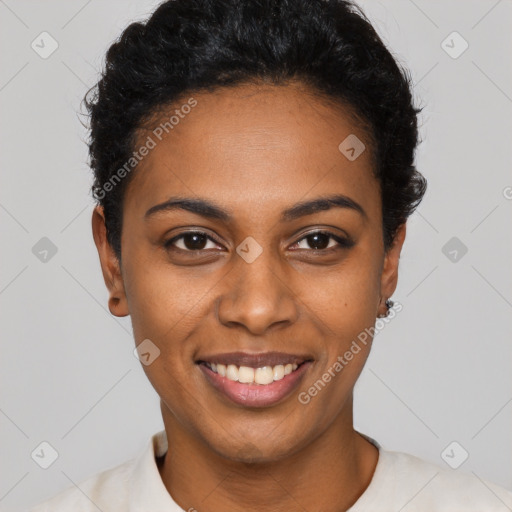 Joyful black young-adult female with short  black hair and brown eyes