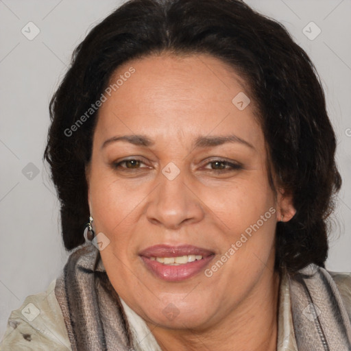 Joyful latino adult female with medium  brown hair and brown eyes