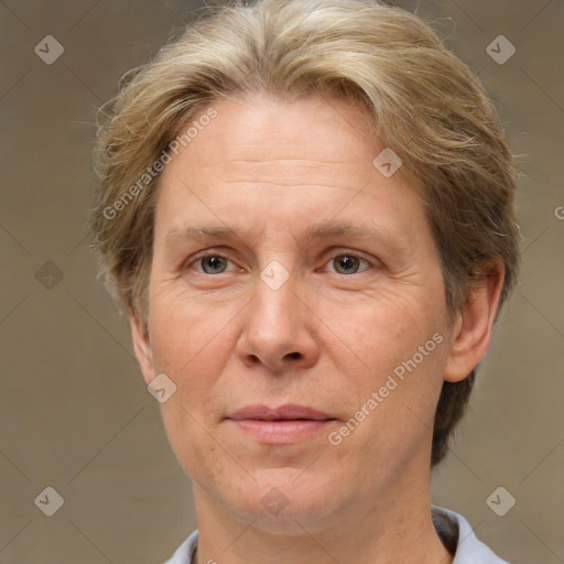 Joyful white middle-aged female with short  brown hair and brown eyes