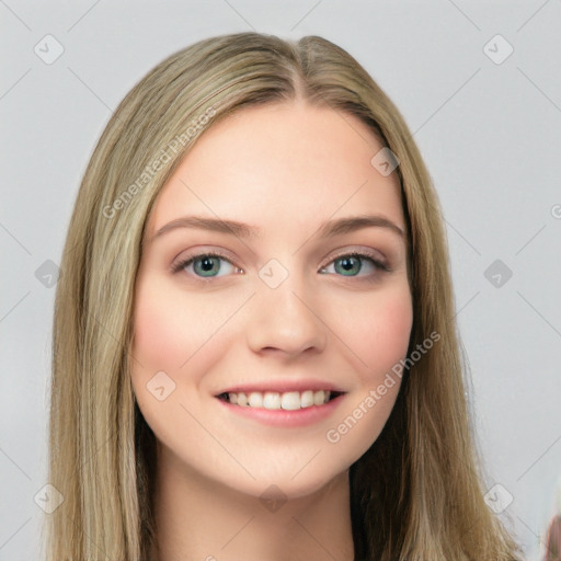 Joyful white young-adult female with long  brown hair and blue eyes