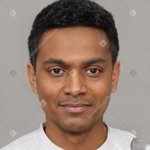 Joyful latino young-adult male with short  black hair and brown eyes