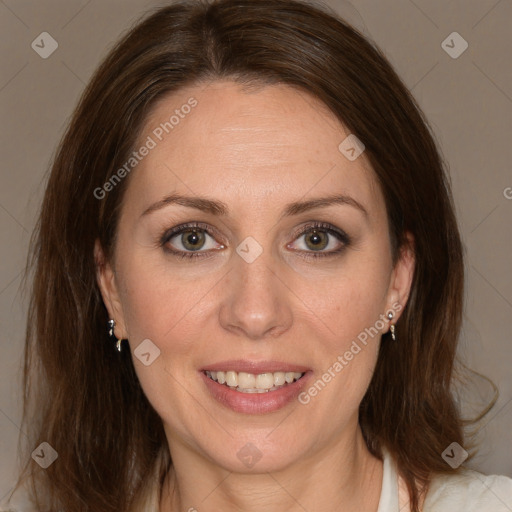 Joyful white adult female with medium  brown hair and grey eyes