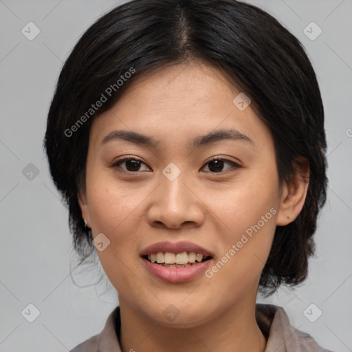 Joyful asian young-adult female with medium  black hair and brown eyes