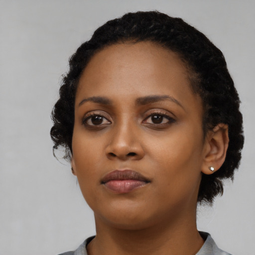 Neutral black young-adult female with short  black hair and brown eyes