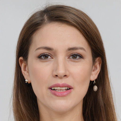 Joyful white young-adult female with long  brown hair and brown eyes