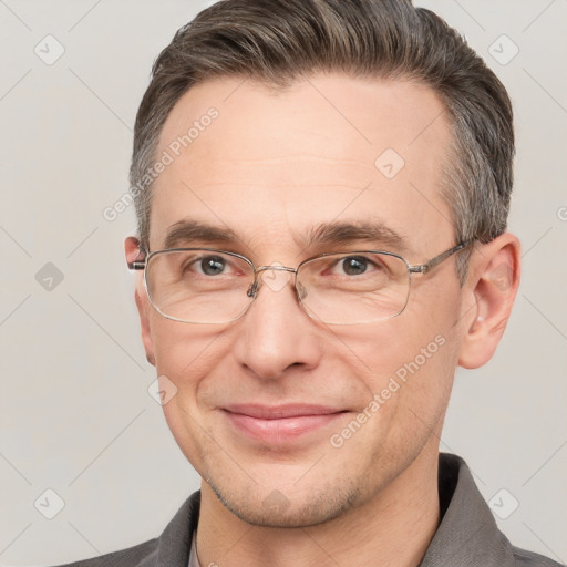 Joyful white adult male with short  brown hair and grey eyes