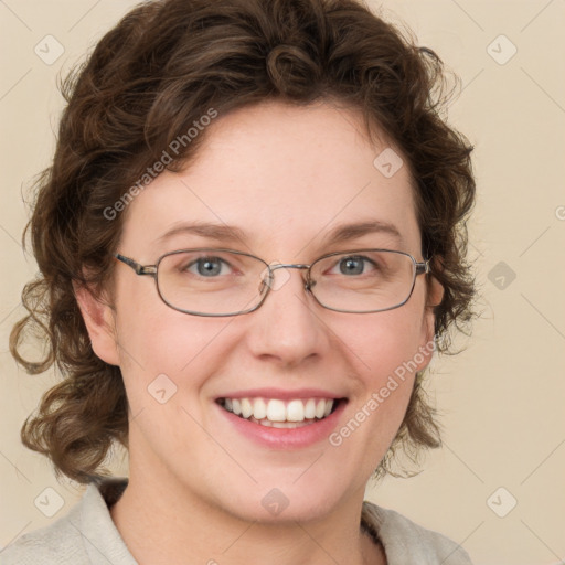 Joyful white adult female with medium  brown hair and blue eyes