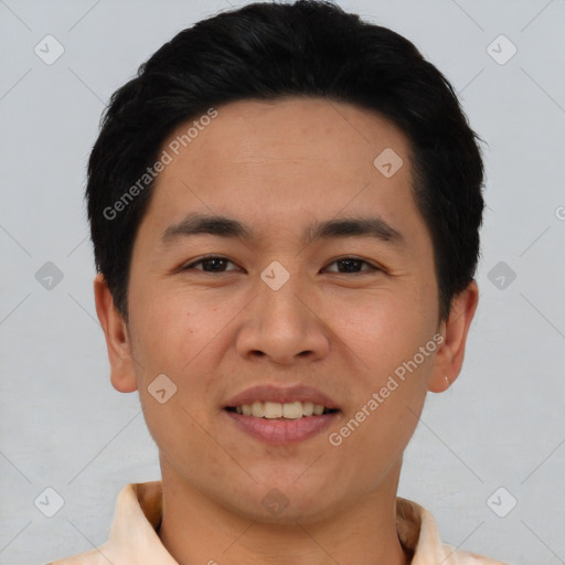 Joyful asian young-adult male with short  black hair and brown eyes