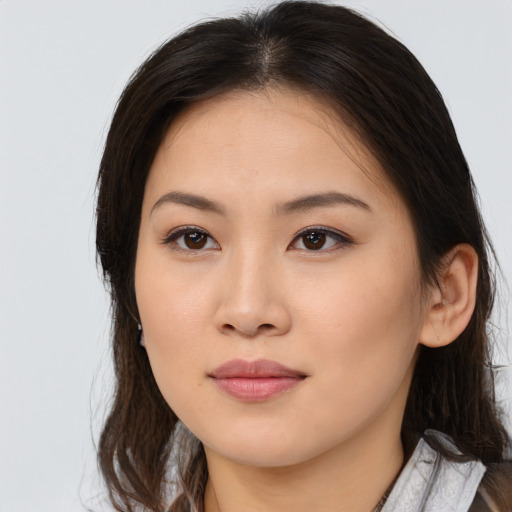 Neutral asian young-adult female with medium  brown hair and brown eyes