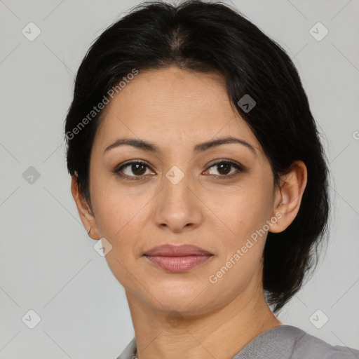 Joyful latino young-adult female with medium  black hair and brown eyes