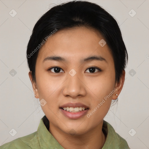 Joyful asian young-adult female with short  black hair and brown eyes