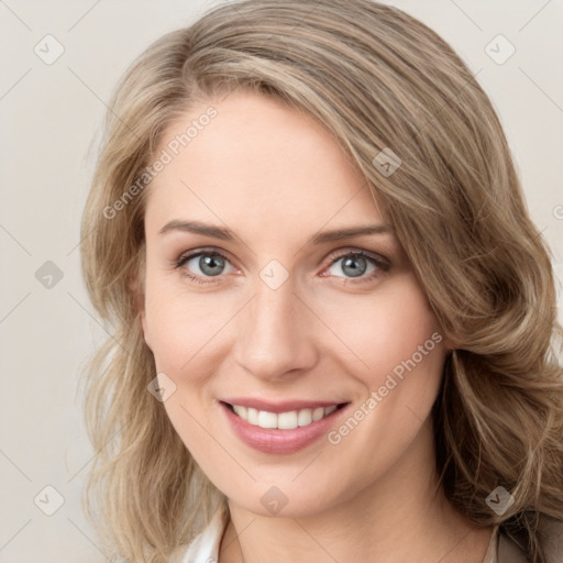 Joyful white young-adult female with medium  brown hair and green eyes