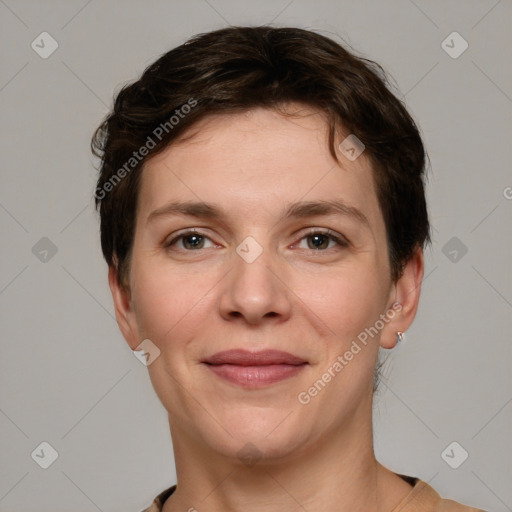 Joyful white young-adult female with short  brown hair and grey eyes