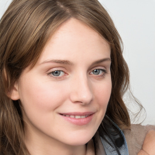 Joyful white young-adult female with long  brown hair and blue eyes