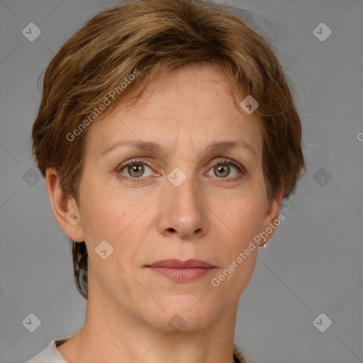 Joyful white adult female with short  brown hair and grey eyes