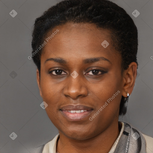 Joyful black young-adult female with short  black hair and brown eyes