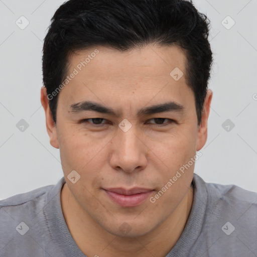 Joyful asian young-adult male with short  brown hair and brown eyes