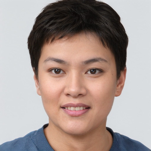 Joyful asian young-adult female with short  brown hair and brown eyes