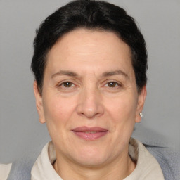 Joyful white adult female with short  brown hair and brown eyes