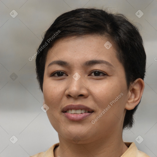 Joyful asian young-adult female with short  brown hair and brown eyes