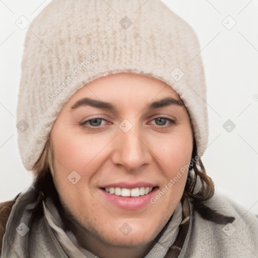 Joyful white young-adult female with short  brown hair and blue eyes