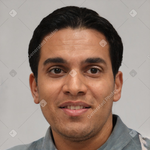 Joyful latino young-adult male with short  black hair and brown eyes