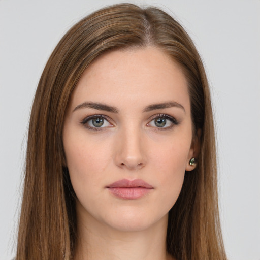 Neutral white young-adult female with long  brown hair and brown eyes