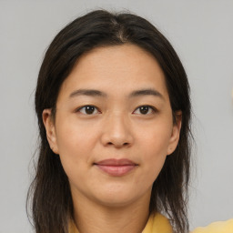 Joyful asian young-adult female with medium  brown hair and brown eyes